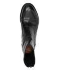 Schwarzer flacher Stiefel